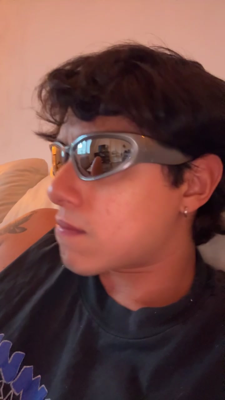 Carlos smiling in cool sunglasses