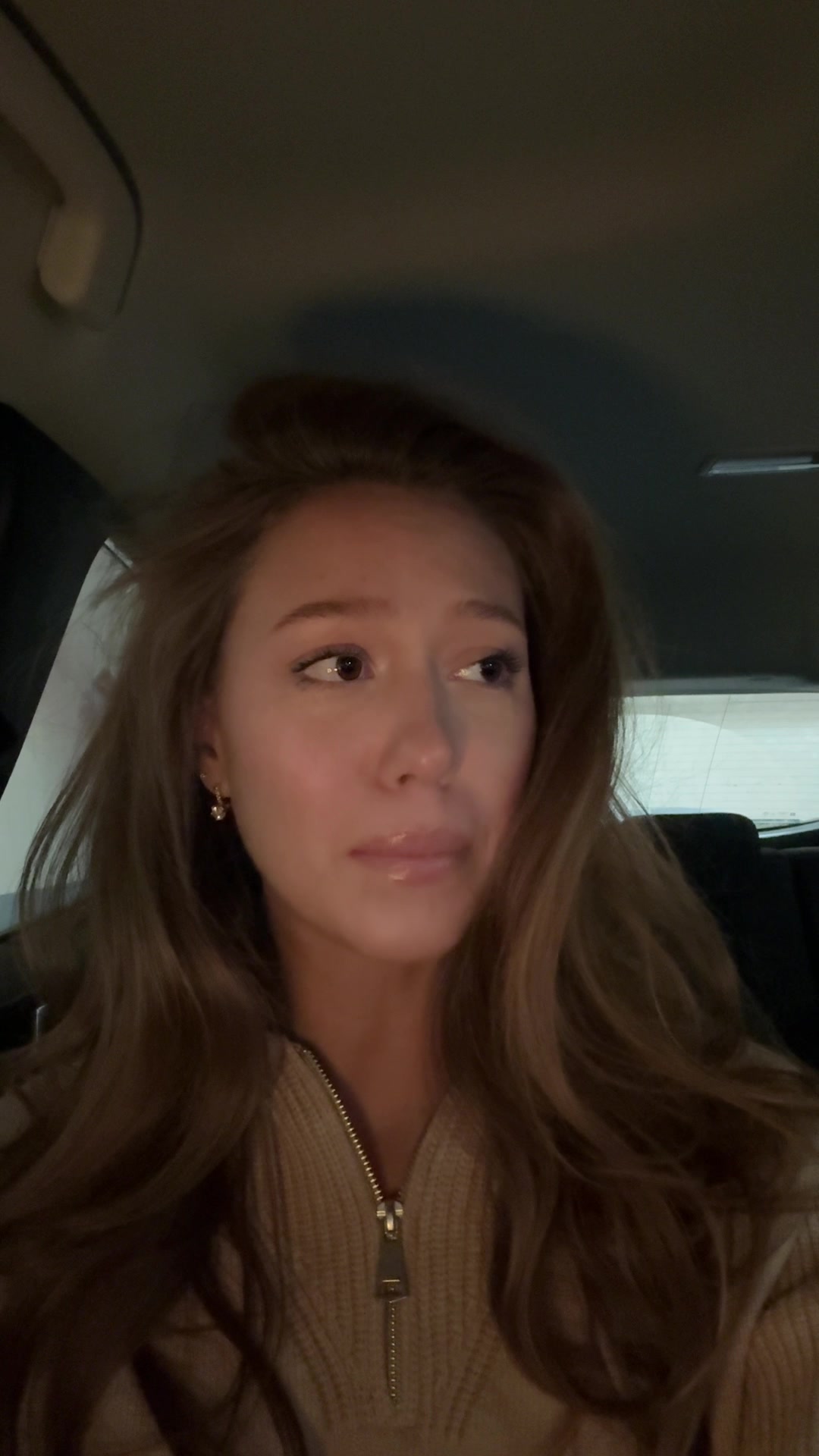 Sad woman wiping away tears