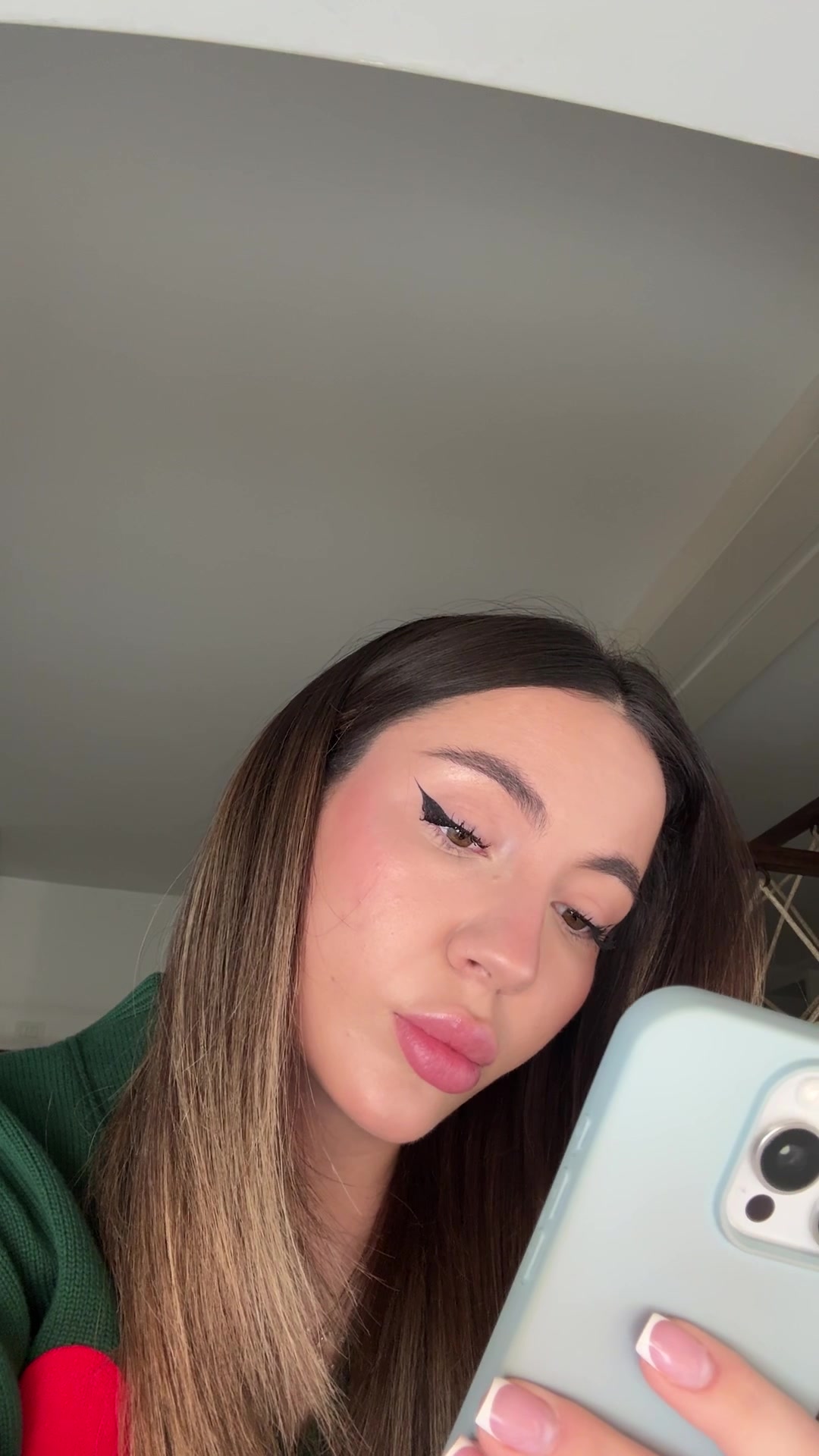 Confident Woman Takes Mirror Selfie
