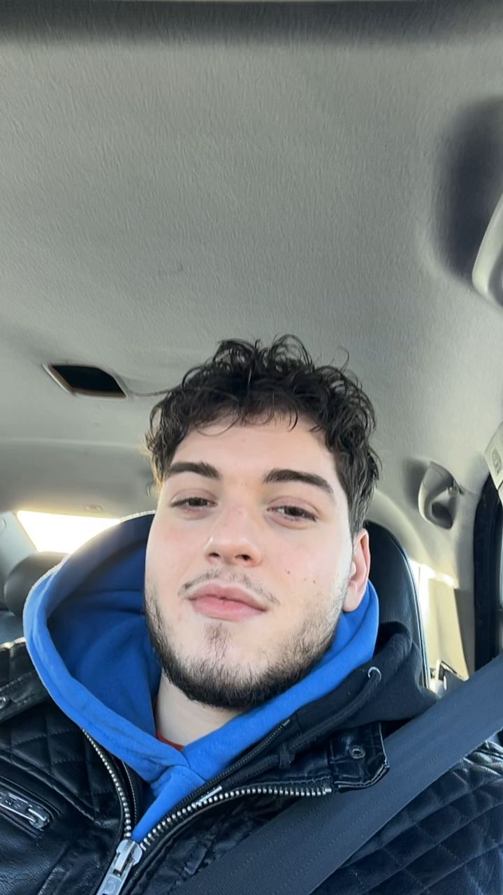Man smiling in the car