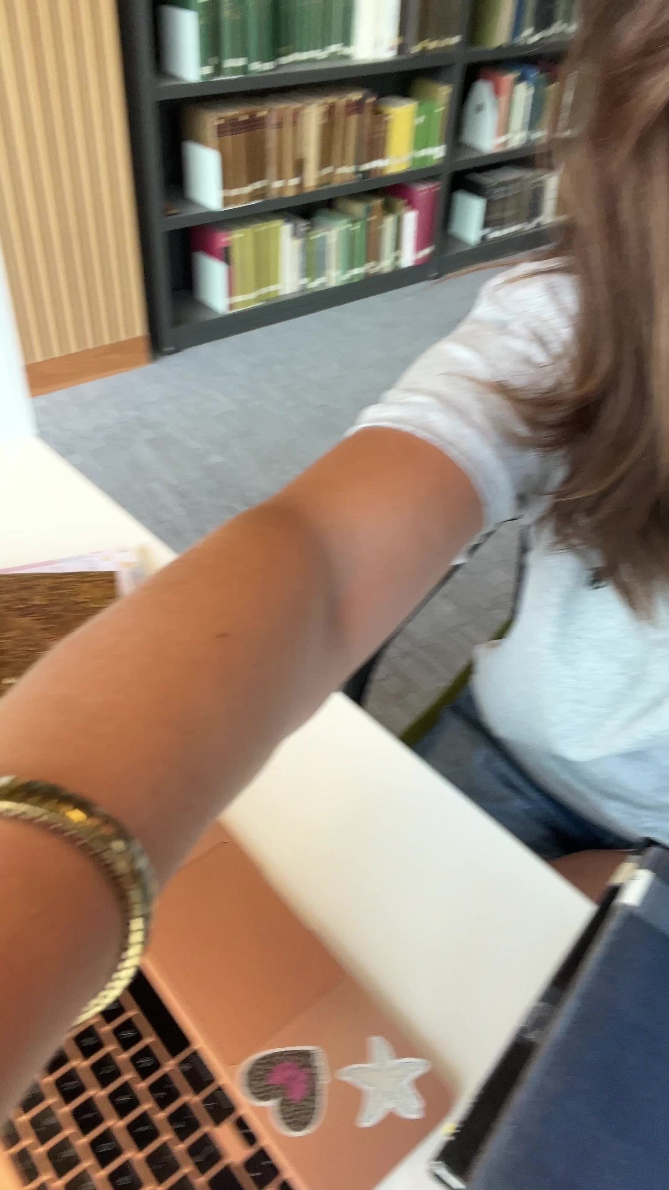 Student Pondering in Library