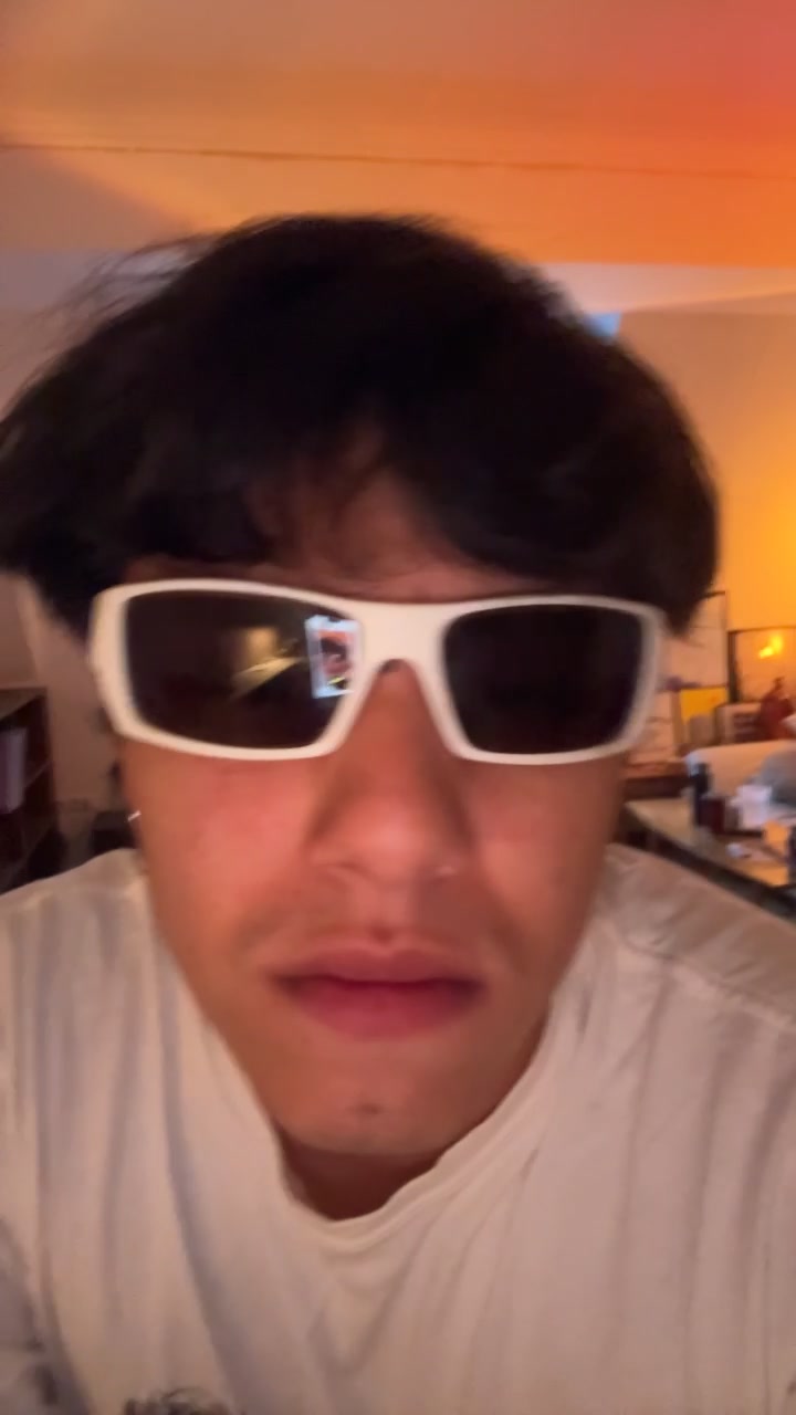 Carlos Wearing White Sunglasses Observing