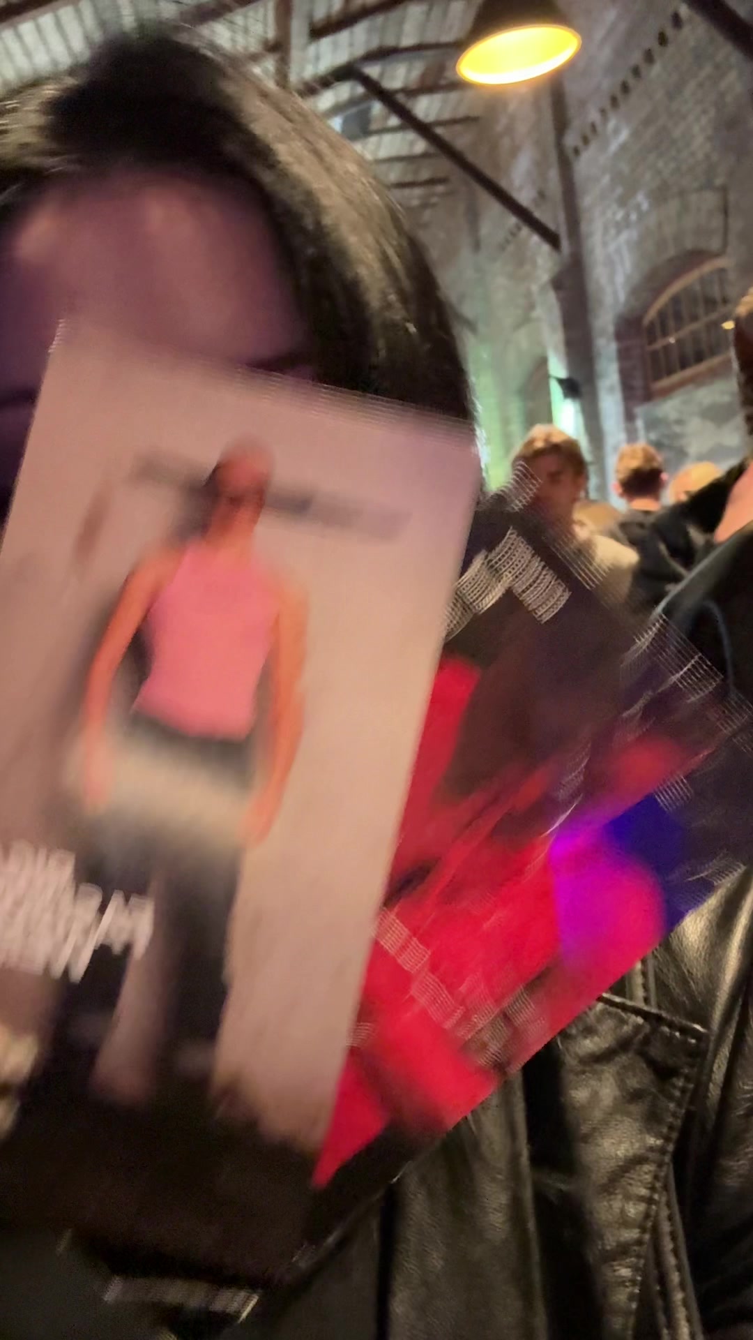 Confident Fan Posing with Vinyl Record