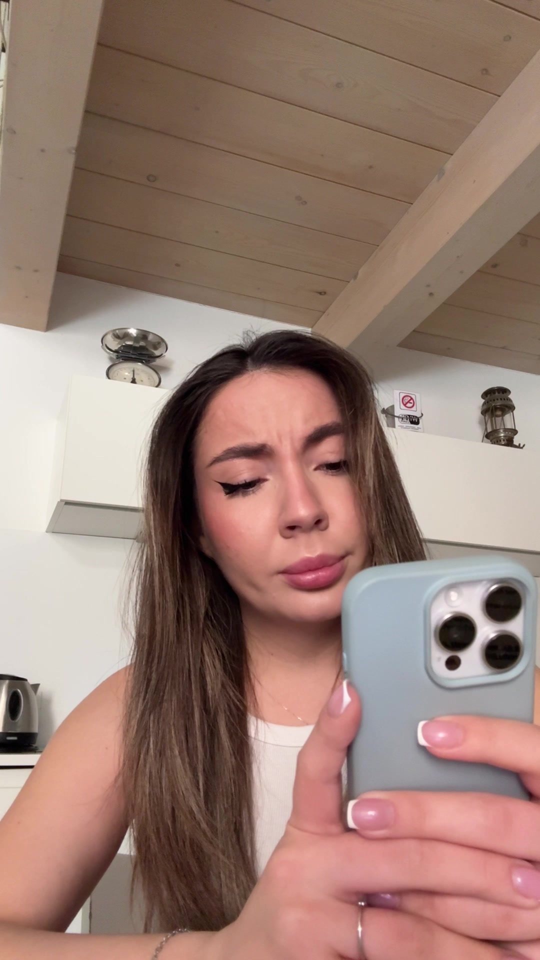 Woman Sneezes with Confused Expression