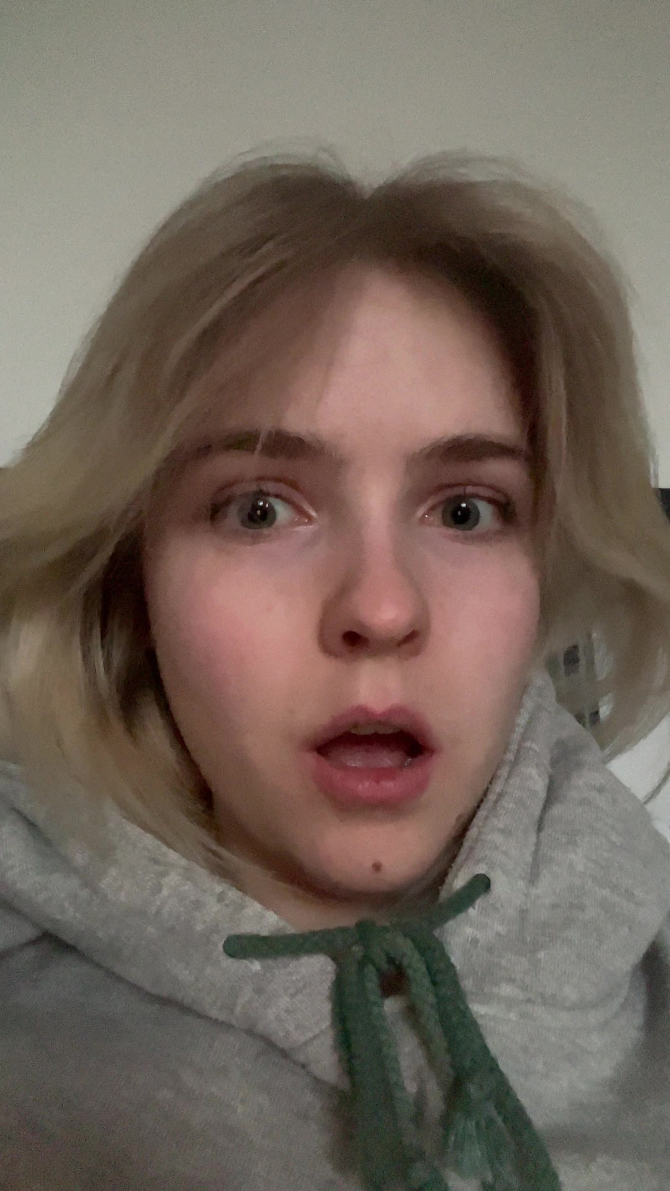 Shocked and then subtle smile