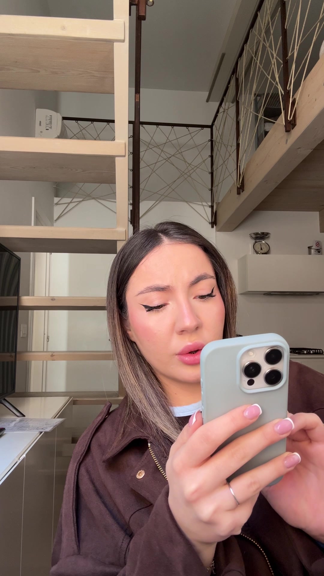 Girl Reacts with Hand Over Mouth