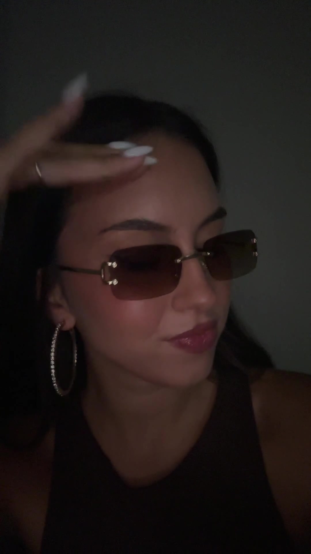 Confident Woman Posing with Sunglasses