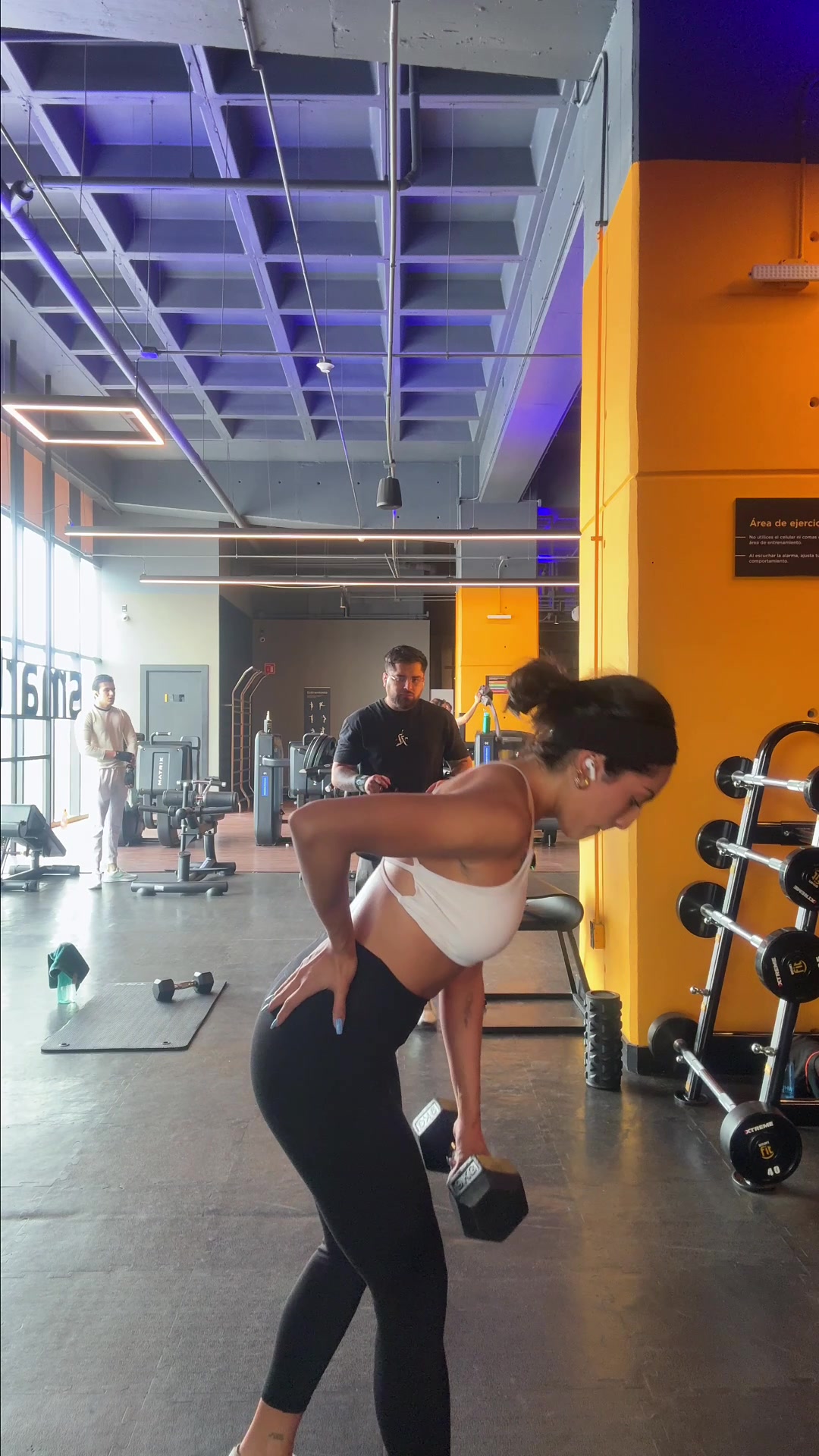 Woman works out with dumbbell