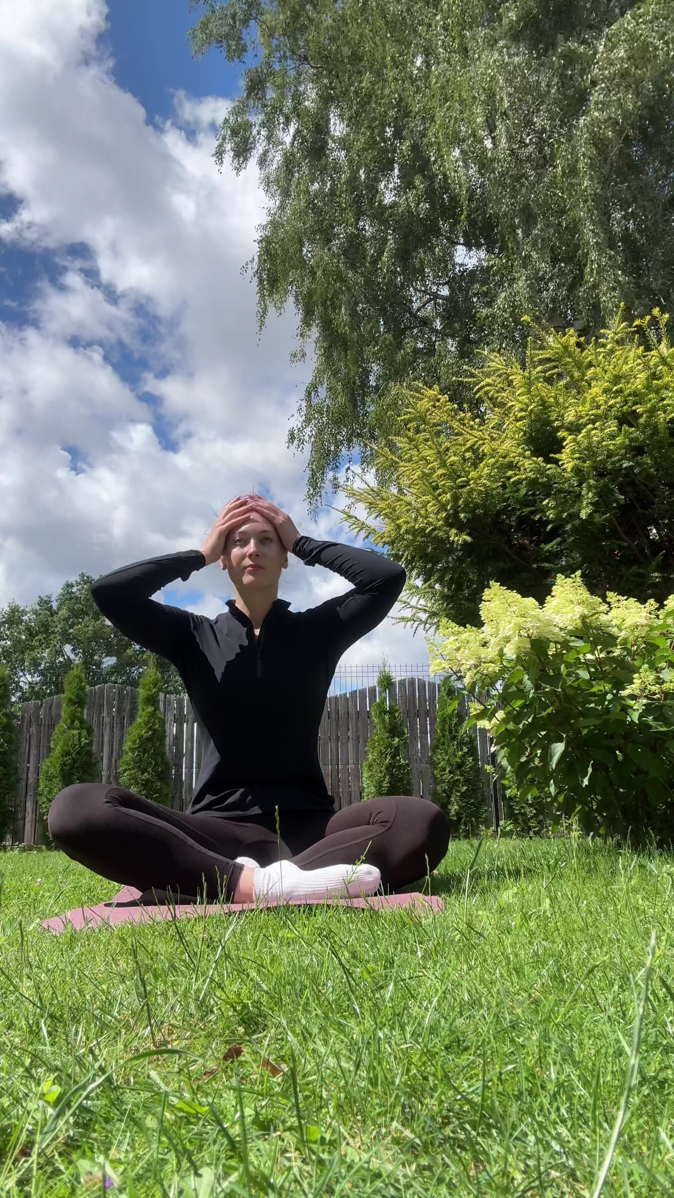 Woman Prepares for Outdoor Yoga Session