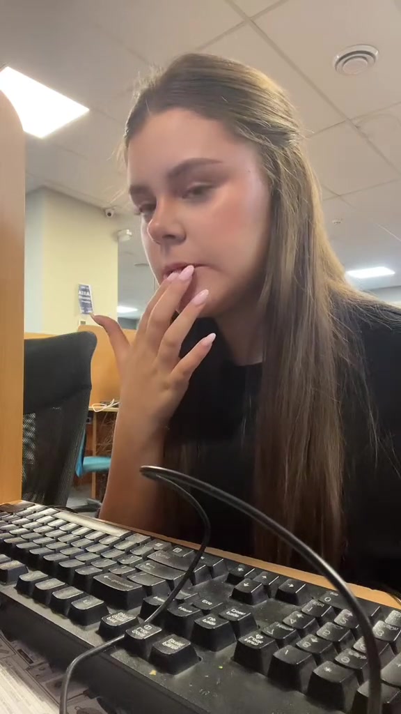 Woman Reacts to Screen in Office
