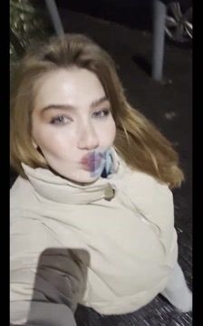 Woman on Wet Street at Night