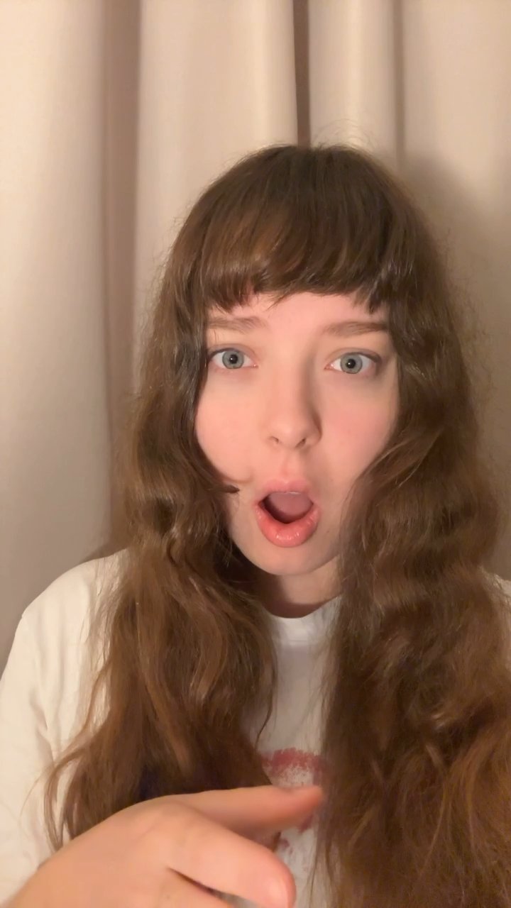 Young Woman Reacts with Surprise